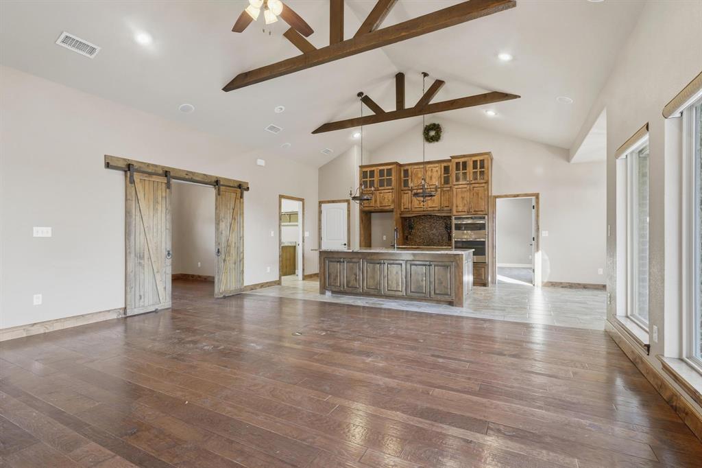 109 Benton Tuscola, TX 79562 - Photo 2 of 40 a view of a kitchen with a sink and a refrigerator