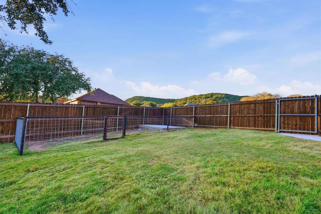 109 Benton Tuscola, TX 79562 - Photo 29 of 40 a view of a backyard with a garden and entertaining space
