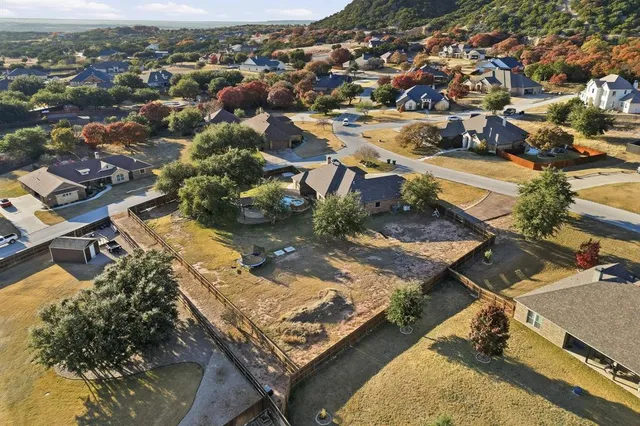an aerial view of residential houses with outdoor space