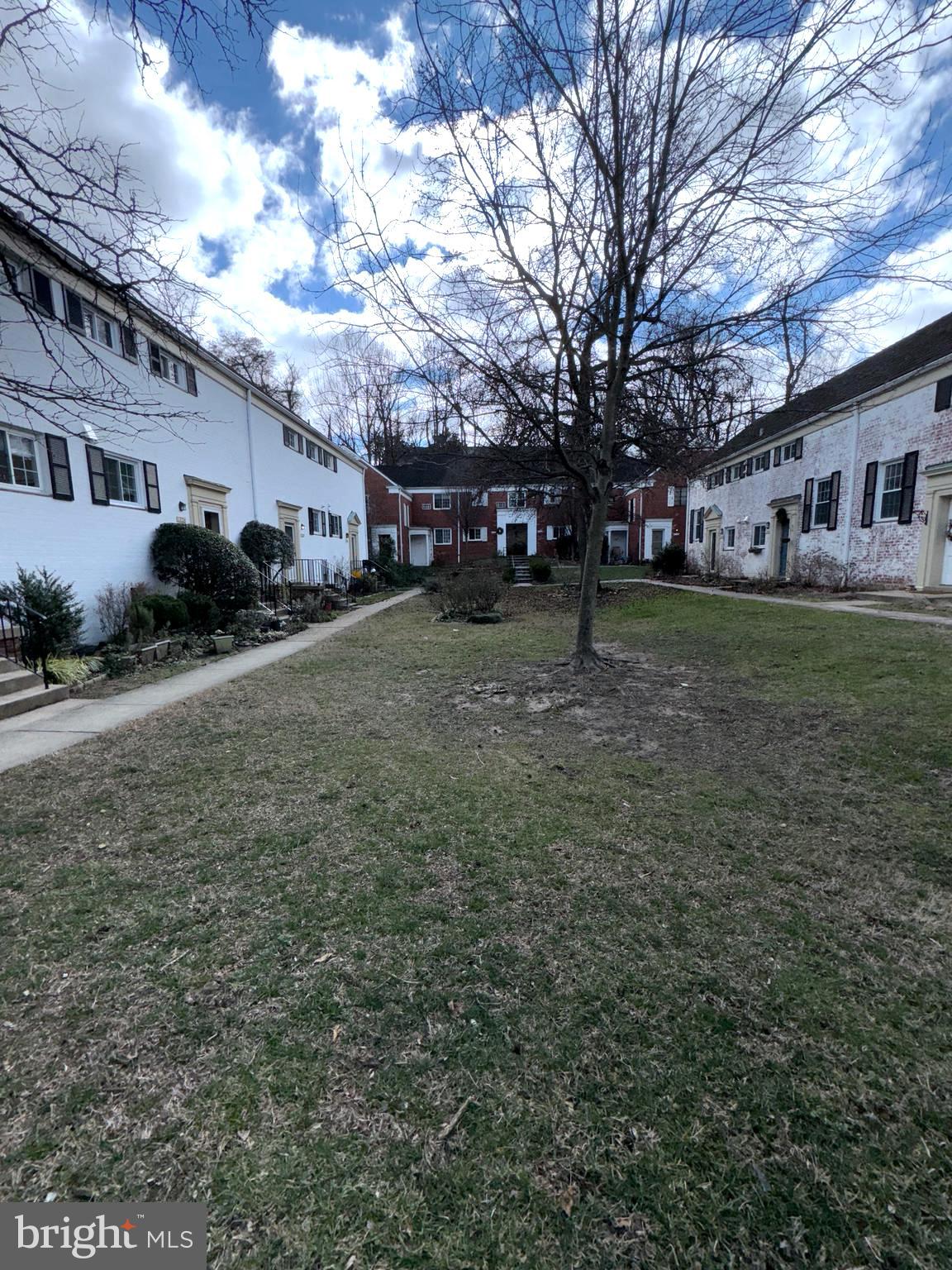 1726 Preston Road Alexandria, VA 22302 - Photo 16 of 16 a yellow house sitting in middle of a field