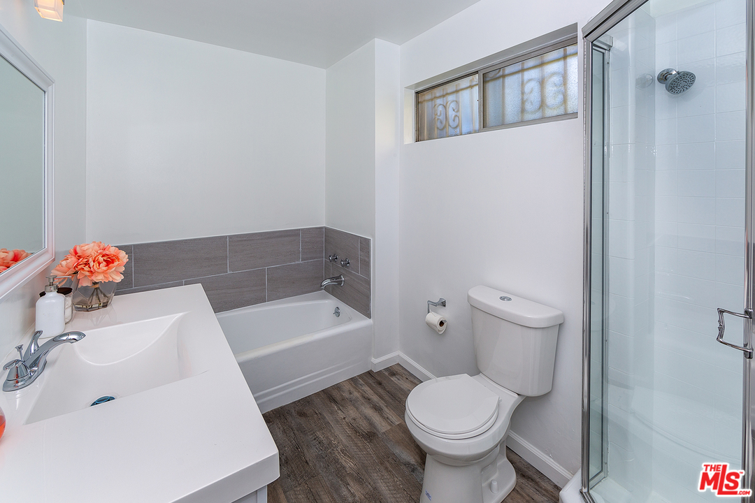 9428 Duxbury Road Los Angeles, CA 90034 - Photo 14 of 17 a bathroom with a sink toilet and shower