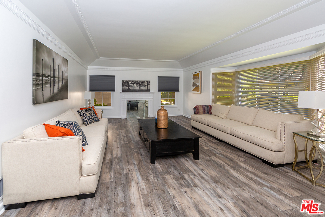 9428 Duxbury Road Los Angeles, CA 90034 - Photo 4 of 17 a living room with furniture and a large window