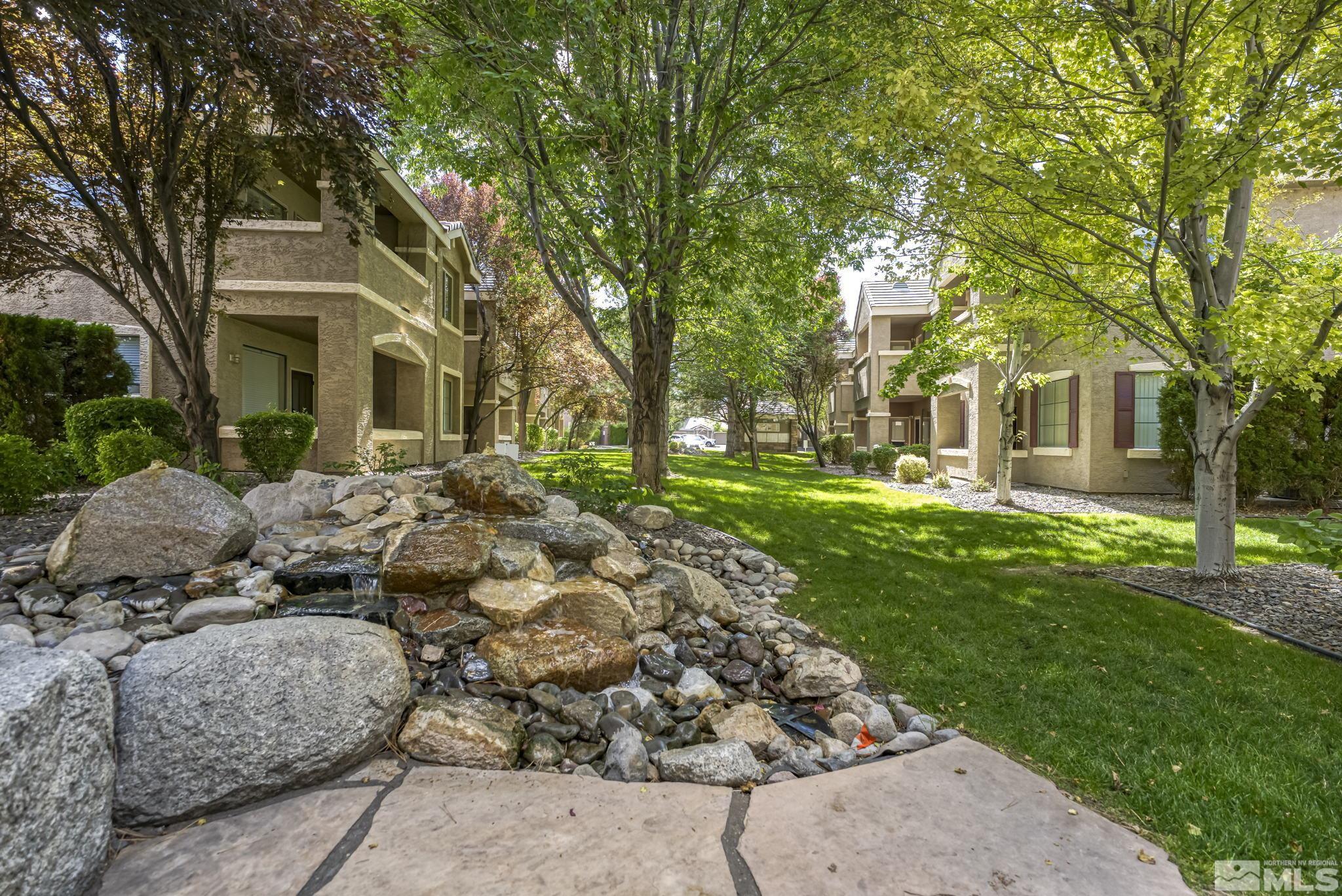 900 South Meadows Parkway, Unit 312 Reno, NV 89521 - Photo 29 of 38 front view of a house with a garden