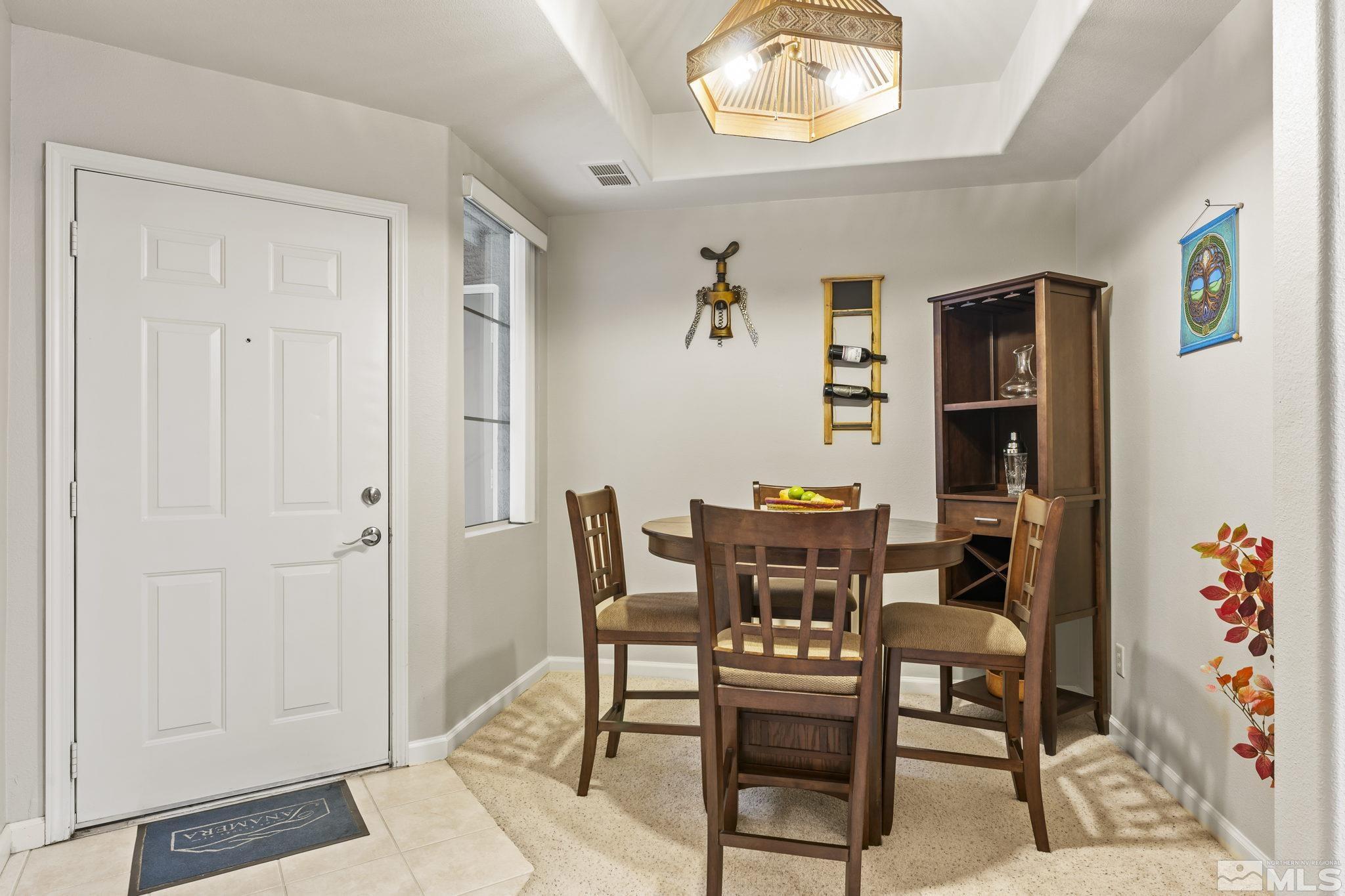 900 South Meadows Parkway, Unit 312 Reno, NV 89521 - Photo 3 of 38 a dining room with furniture and window