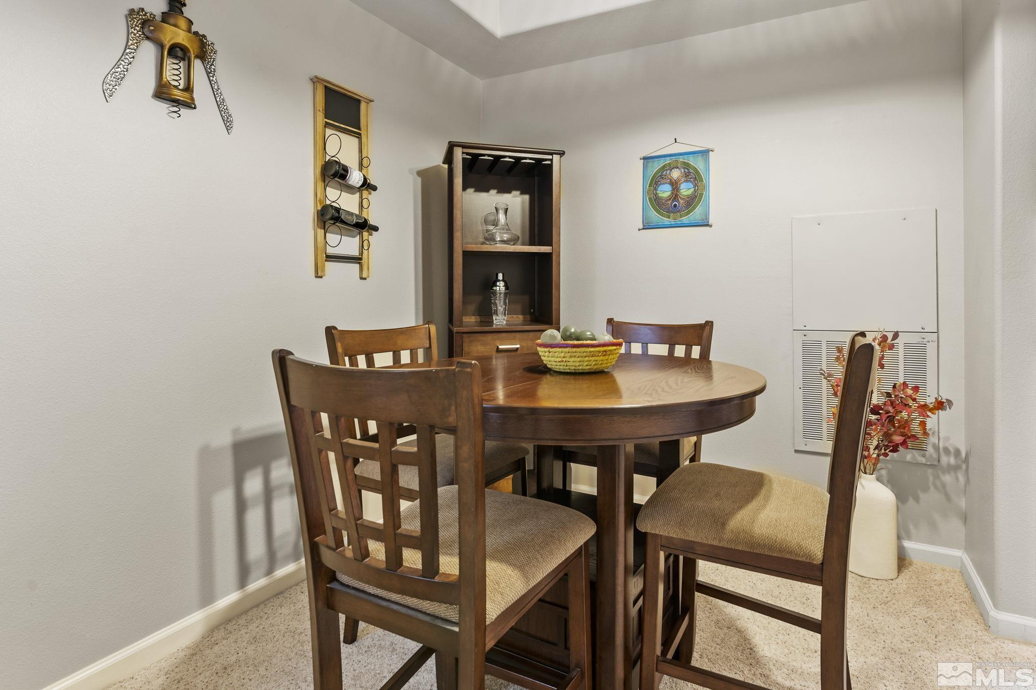 900 South Meadows Parkway, Unit 312 Reno, NV 89521 - Photo 4 of 38 a view of a dining room with furniture and wooden floor