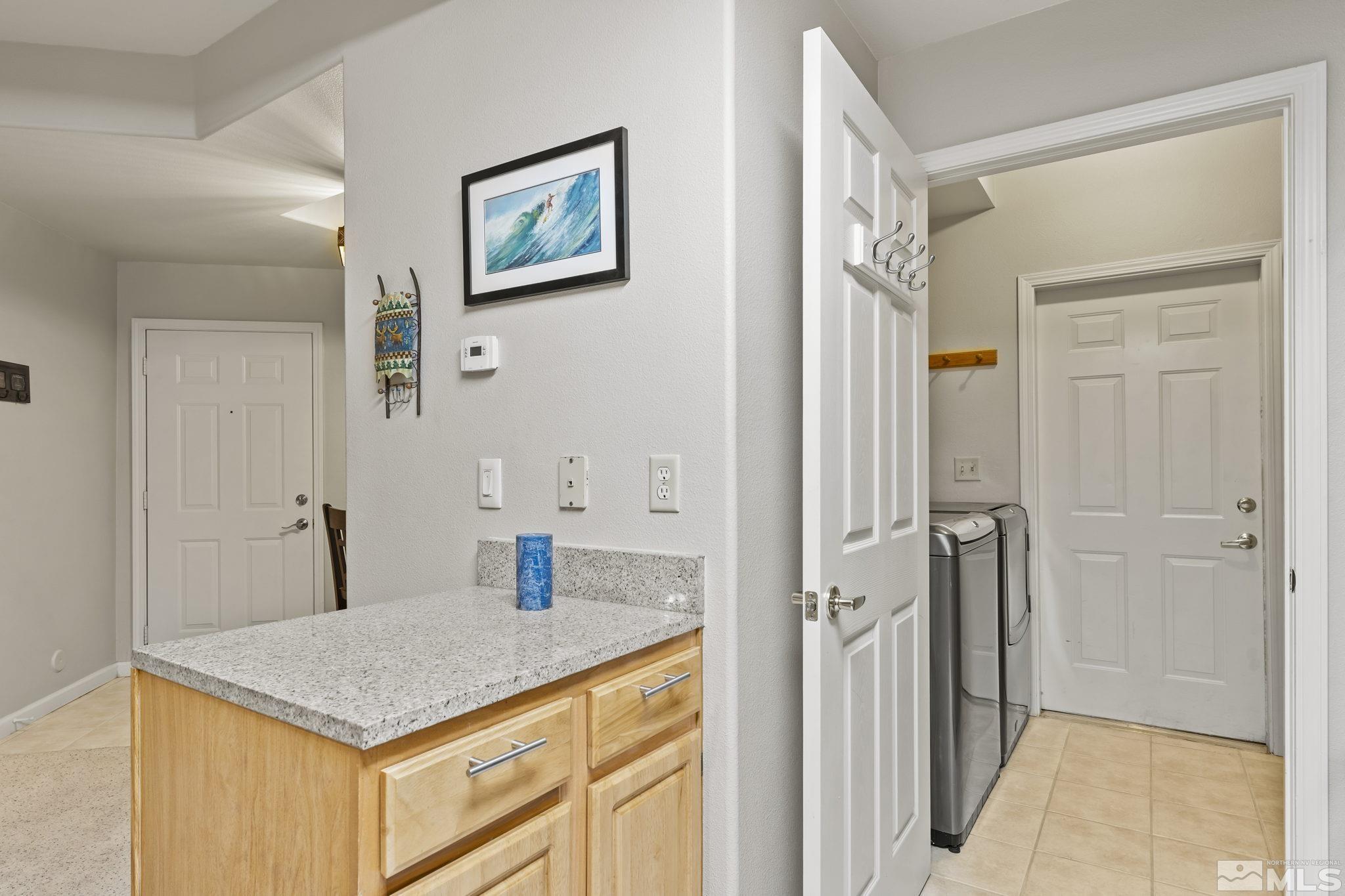 900 South Meadows Parkway, Unit 312 Reno, NV 89521 - Photo 9 of 38 a bathroom with a sink vanity and a mirror