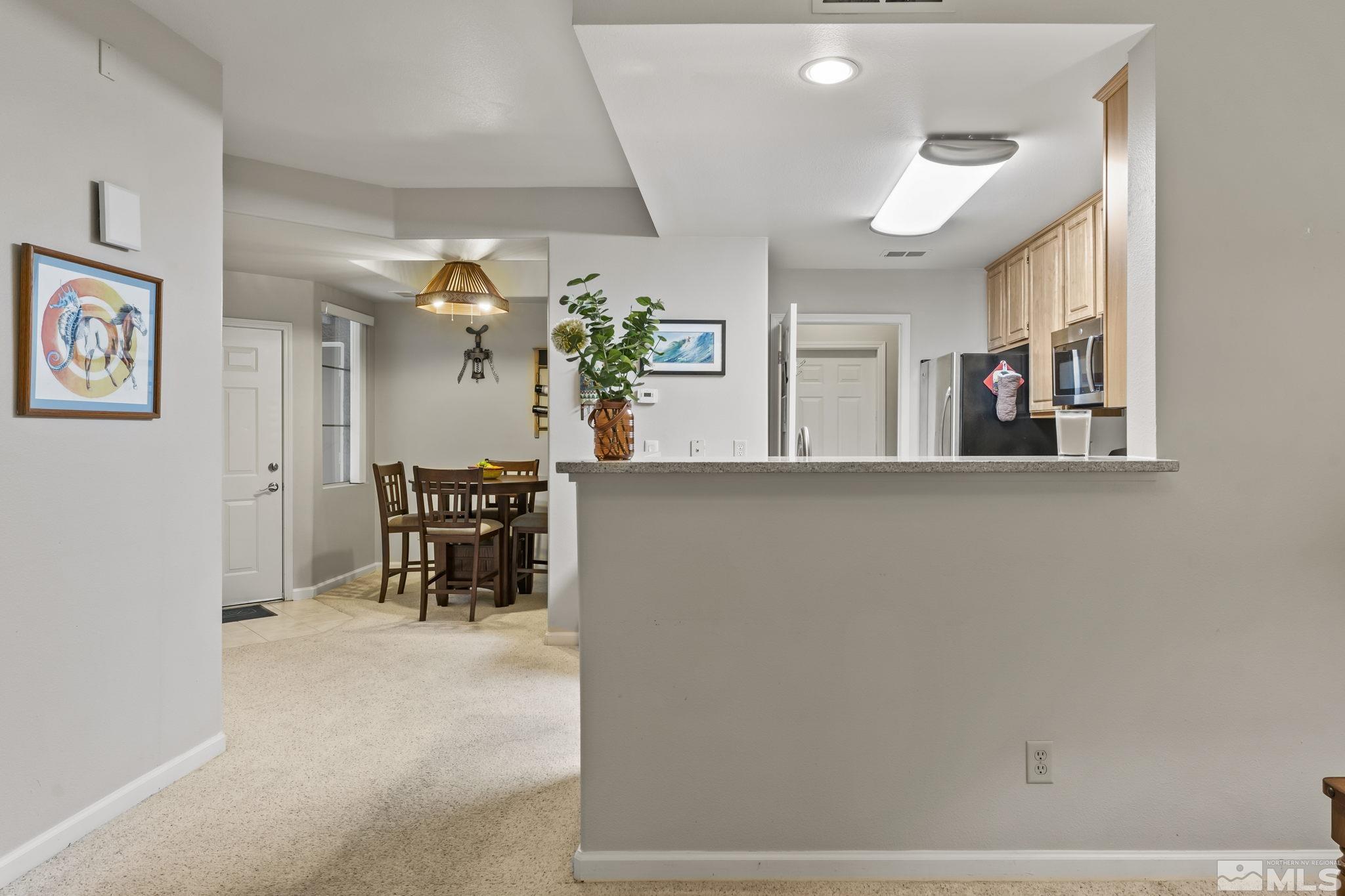 900 South Meadows Parkway, Unit 312 Reno, NV 89521 - Photo 10 of 38 a view of a living room and dining room