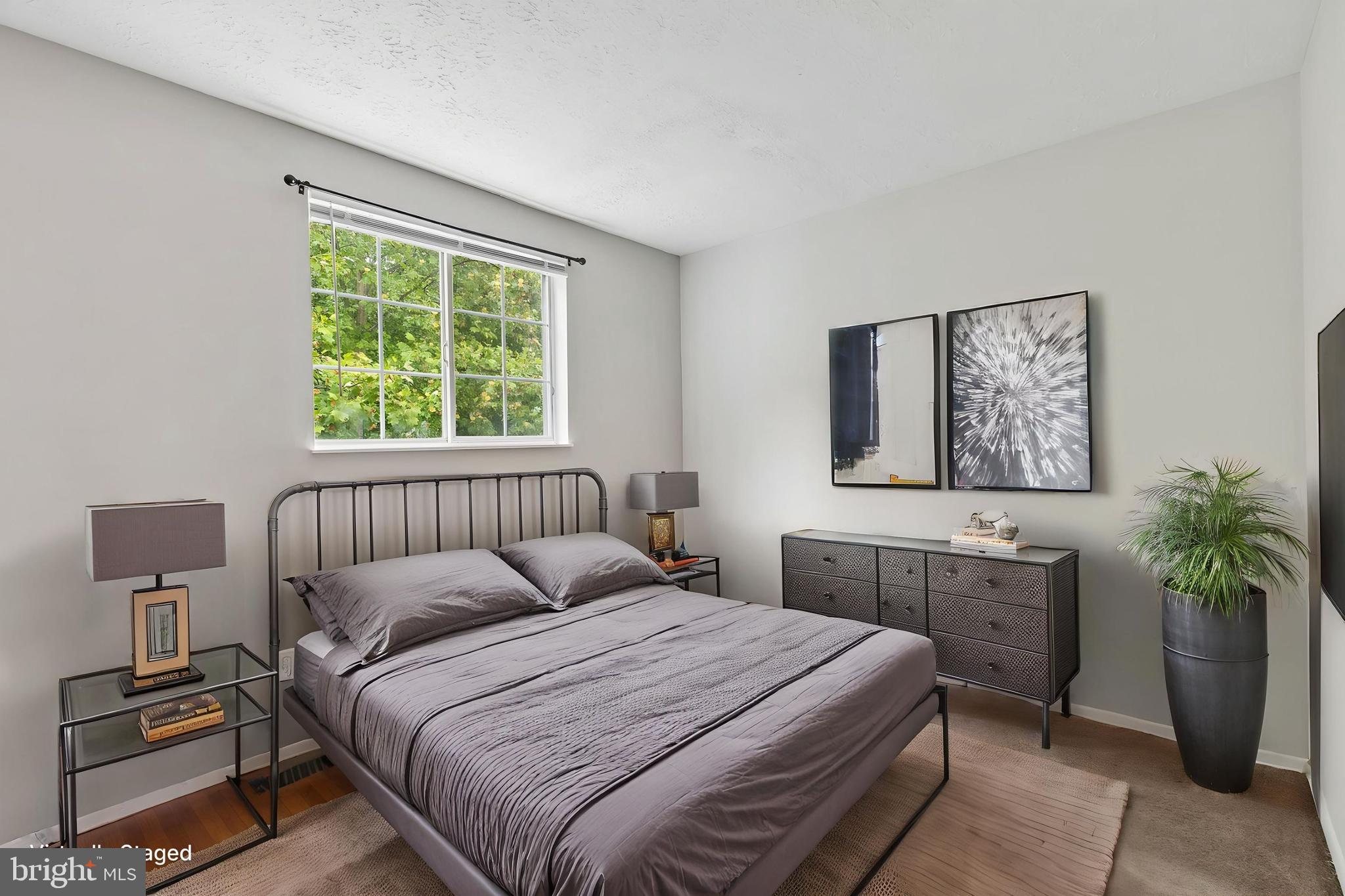8317 Brookvale Court Springfield, VA 22153 - Photo 6 of 33 a bedroom with a large bed and a window