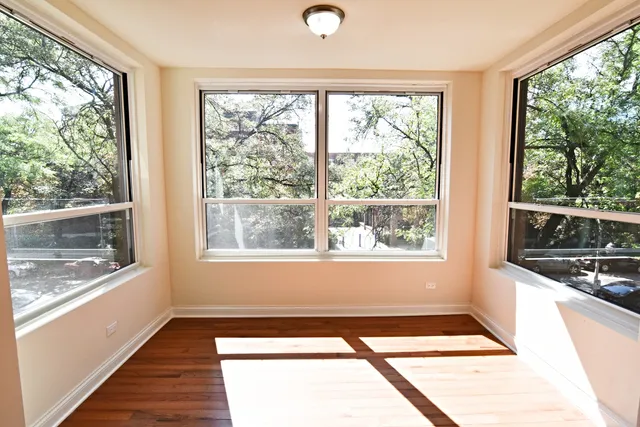 a view of an empty room with a window