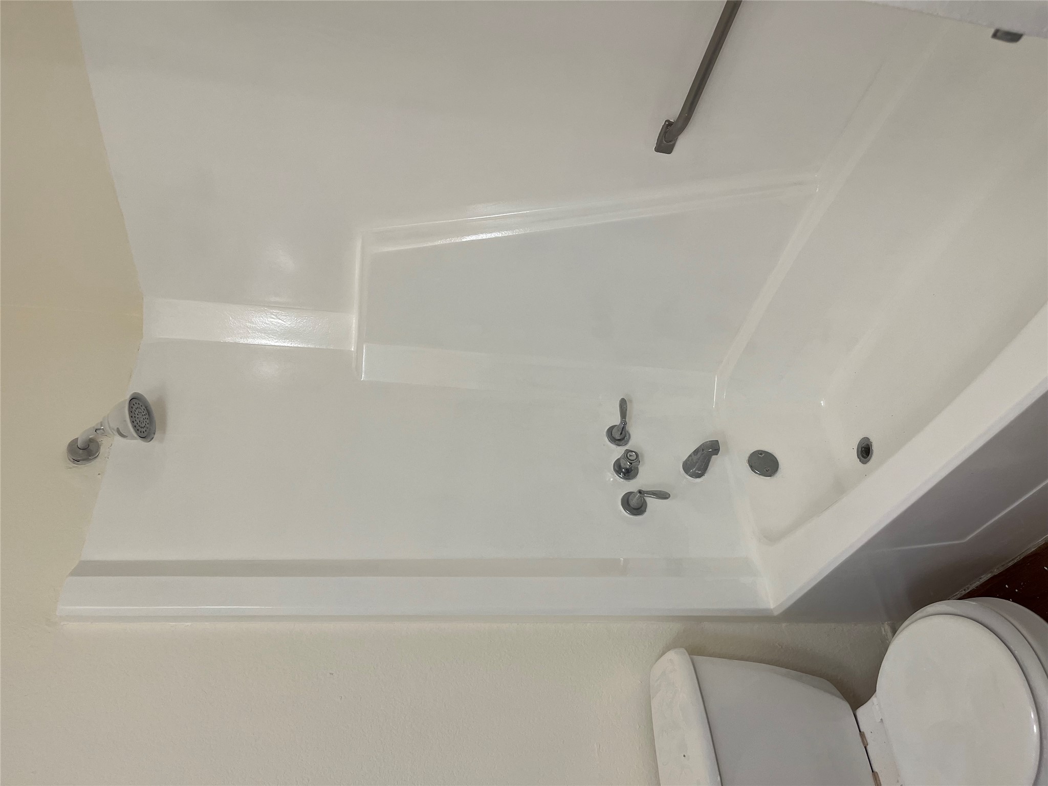 23393 Nameless Road, Unit 144 Leander, TX 78641 - Photo 15 of 23 Bathroom with toilet and washtub / shower combination