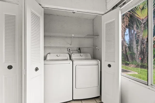 a utility room with dryer and washer