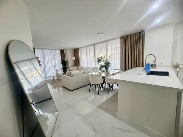 a living room with furniture and a window