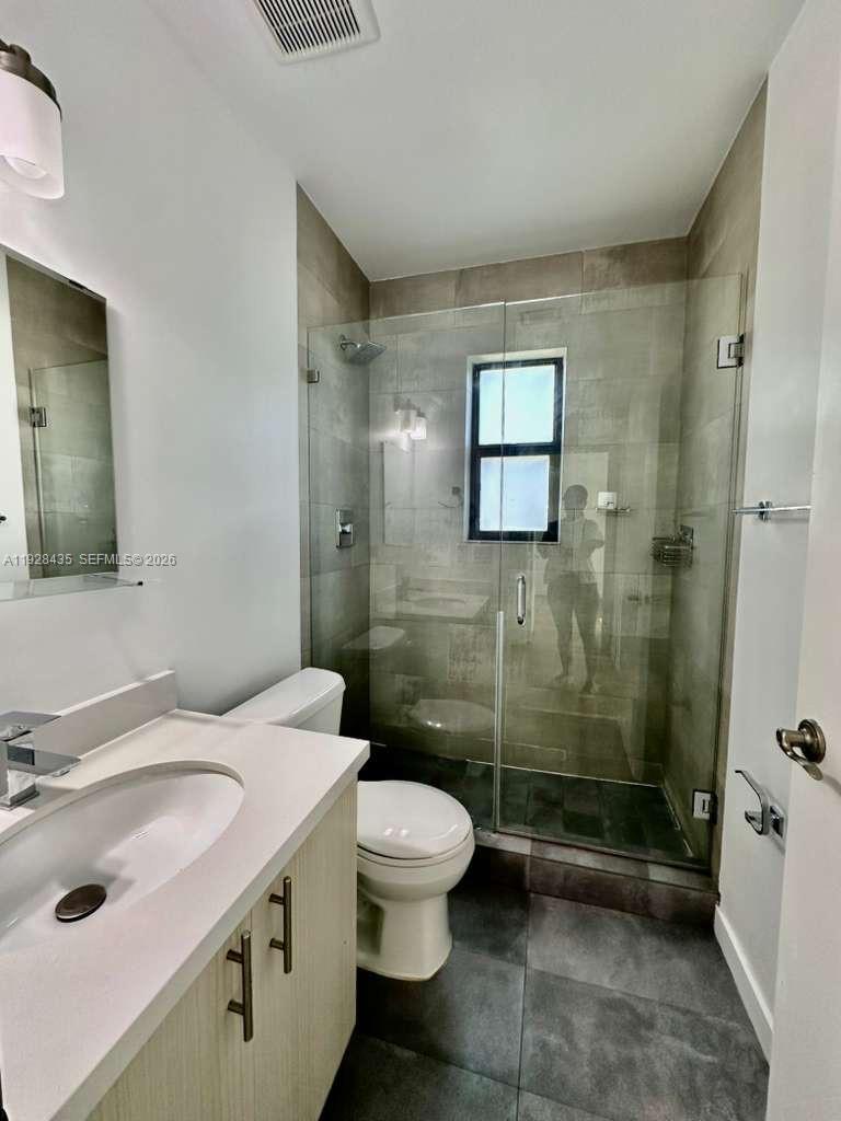 4204 Southwest 14th Street, Unit 3 Miami, FL 33134 - Photo 12 of 15 a bathroom with a sink toilet and shower