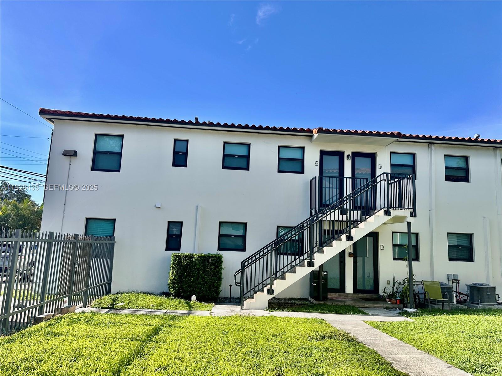 4204 Southwest 14th Street, Unit 3 Miami, FL 33134 - Photo 2 of 12 a front view of a house with a yard