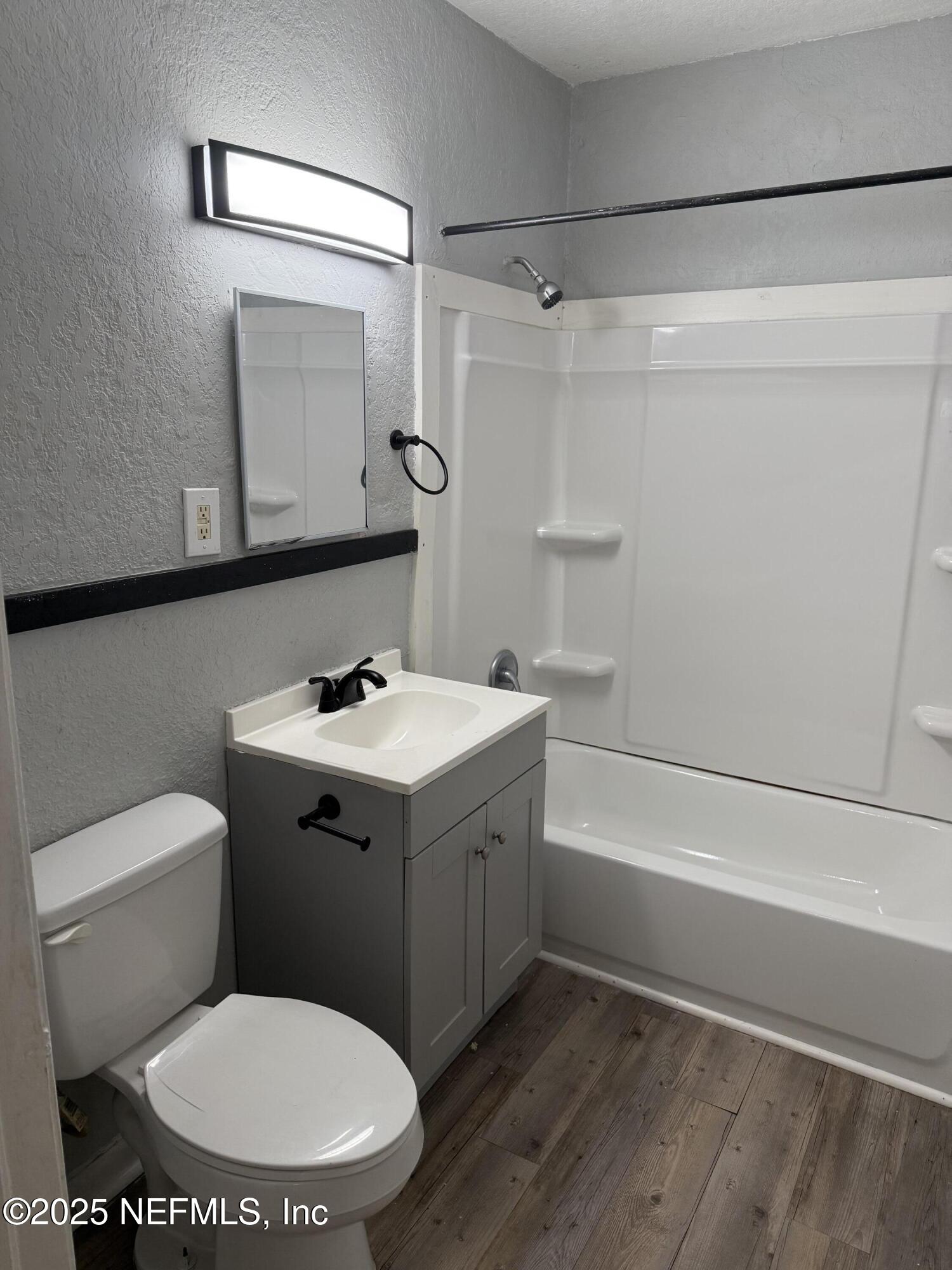 1925 Jones Street Jacksonville, FL 32206 - Photo 6 of 6 a bathroom with a sink mirror vanity and toilet
