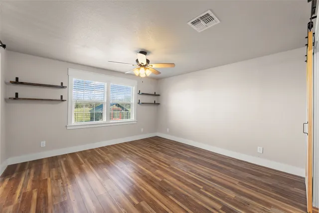 a view of empty room and wooden floor