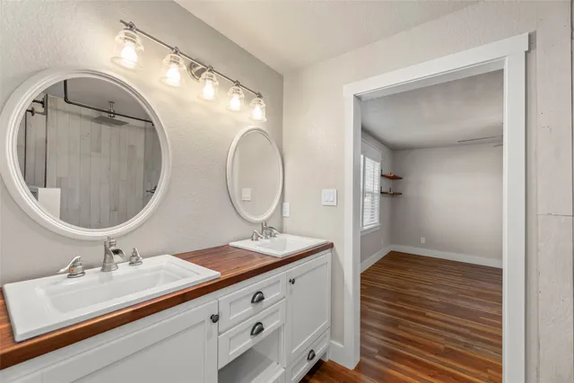 a view of a house with wooden floor and iron fence
