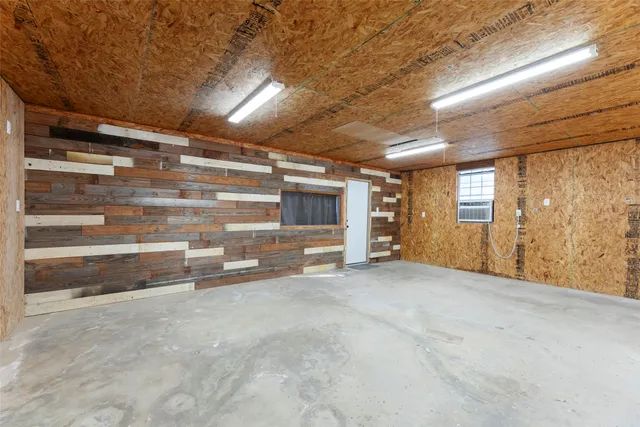 a view of a house with backyard water fountain and sitting area