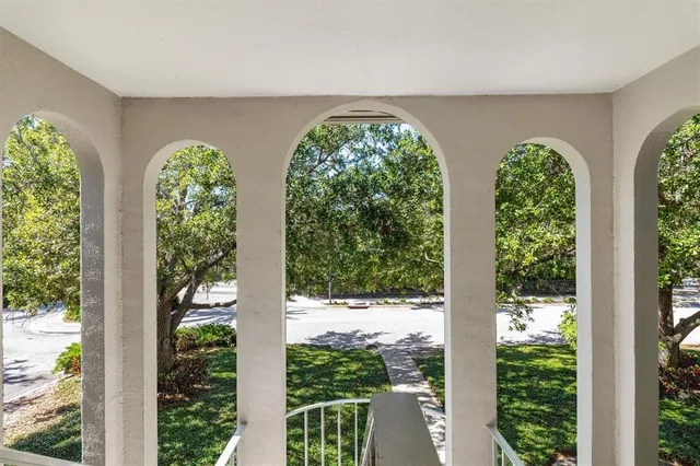 a view of a garden with a large trees