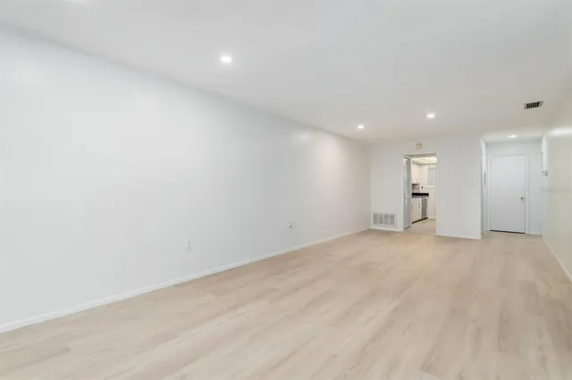 a view of empty room with a sink