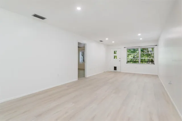 a view of an empty room with a window