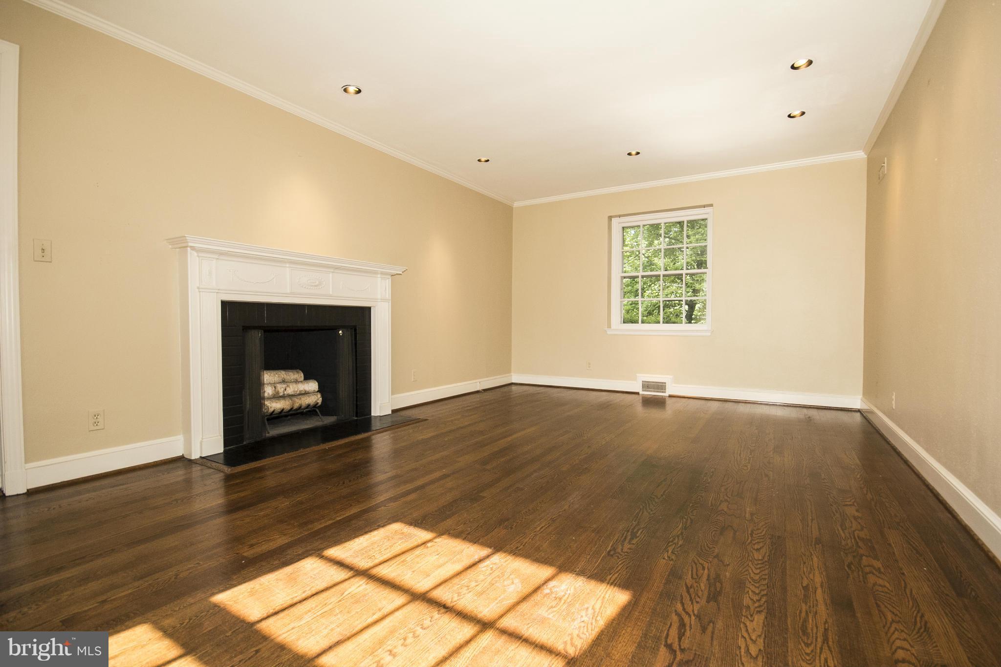 5504 Kemper Road Baltimore, MD 21210 - Photo 11 of 29 Living Room with Cozy Fireplace