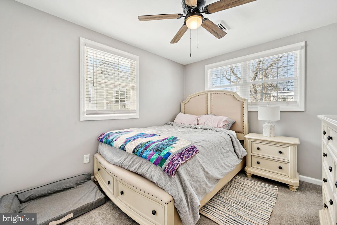 8 Lancia Place Lindenwold, NJ 08021 - Photo 14 of 24 a bedroom with a bed and a chandelier