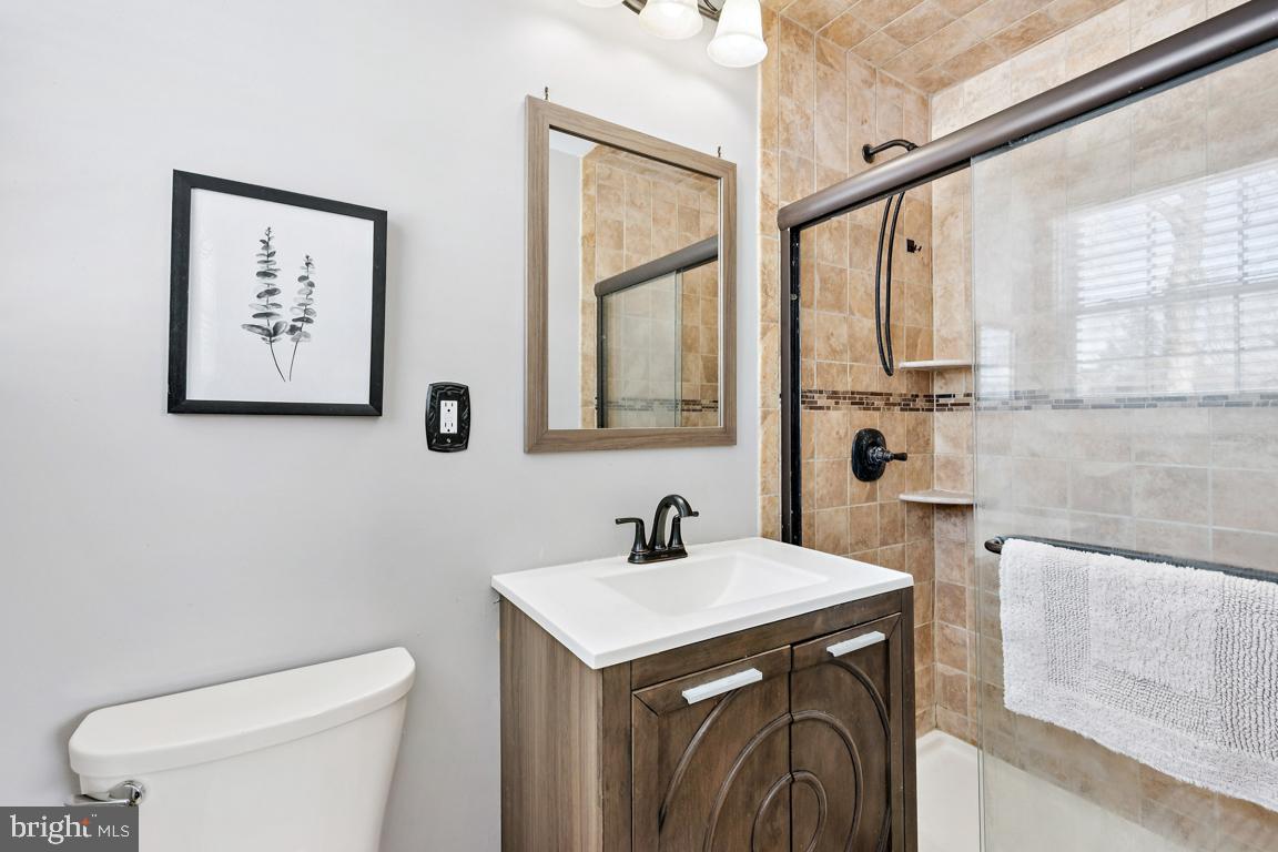 8 Lancia Place Lindenwold, NJ 08021 - Photo 15 of 24 a bathroom with a sink a toilet and a mirror