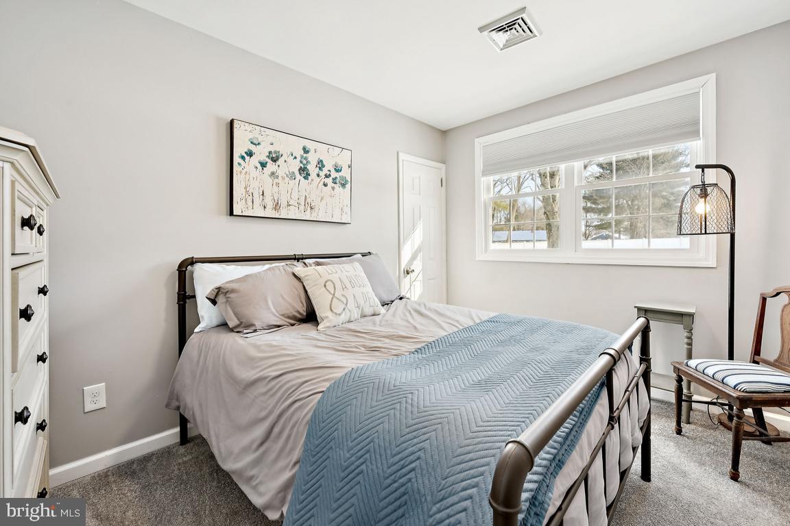 8 Lancia Place Lindenwold, NJ 08021 - Photo 17 of 24 a bedroom with a bed and a table next to a window