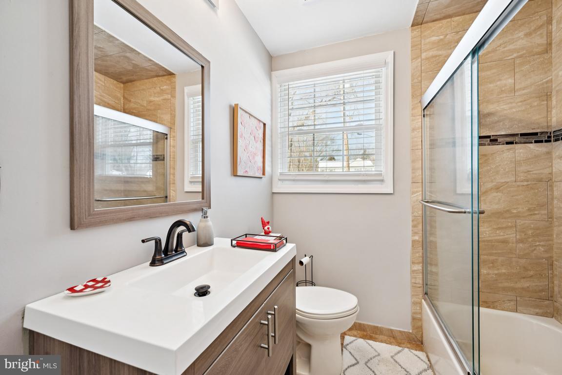 8 Lancia Place Lindenwold, NJ 08021 - Photo 19 of 24 a bathroom with a sink a toilet and a window