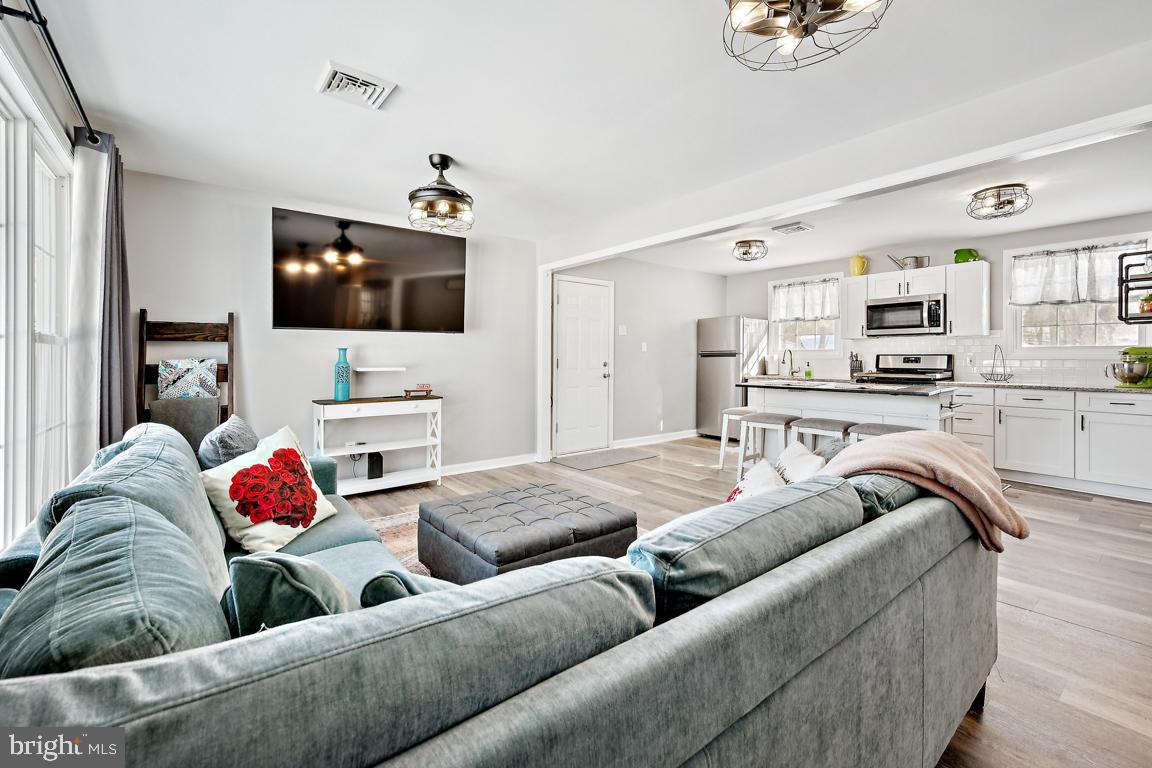 8 Lancia Place Lindenwold, NJ 08021 - Photo 4 of 24 a living room with furniture and a flat screen tv