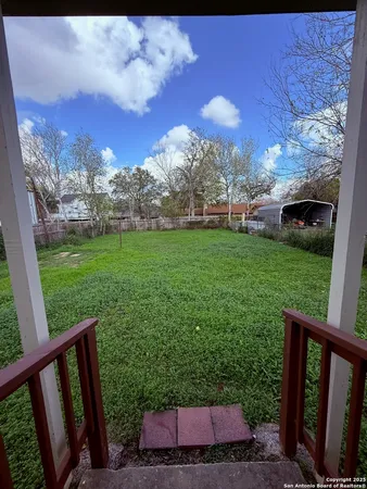 a view of a yard with an outdoor space