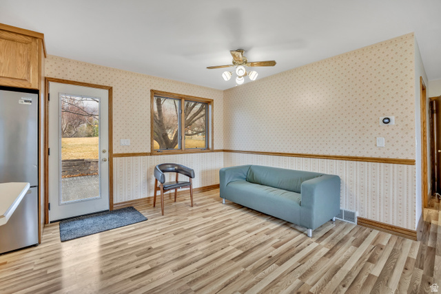 887 Village Way Alpine, UT 84004 - Photo 18 of 28 Living area with a ceiling fan, light wood finished floors, and wallpapered walls