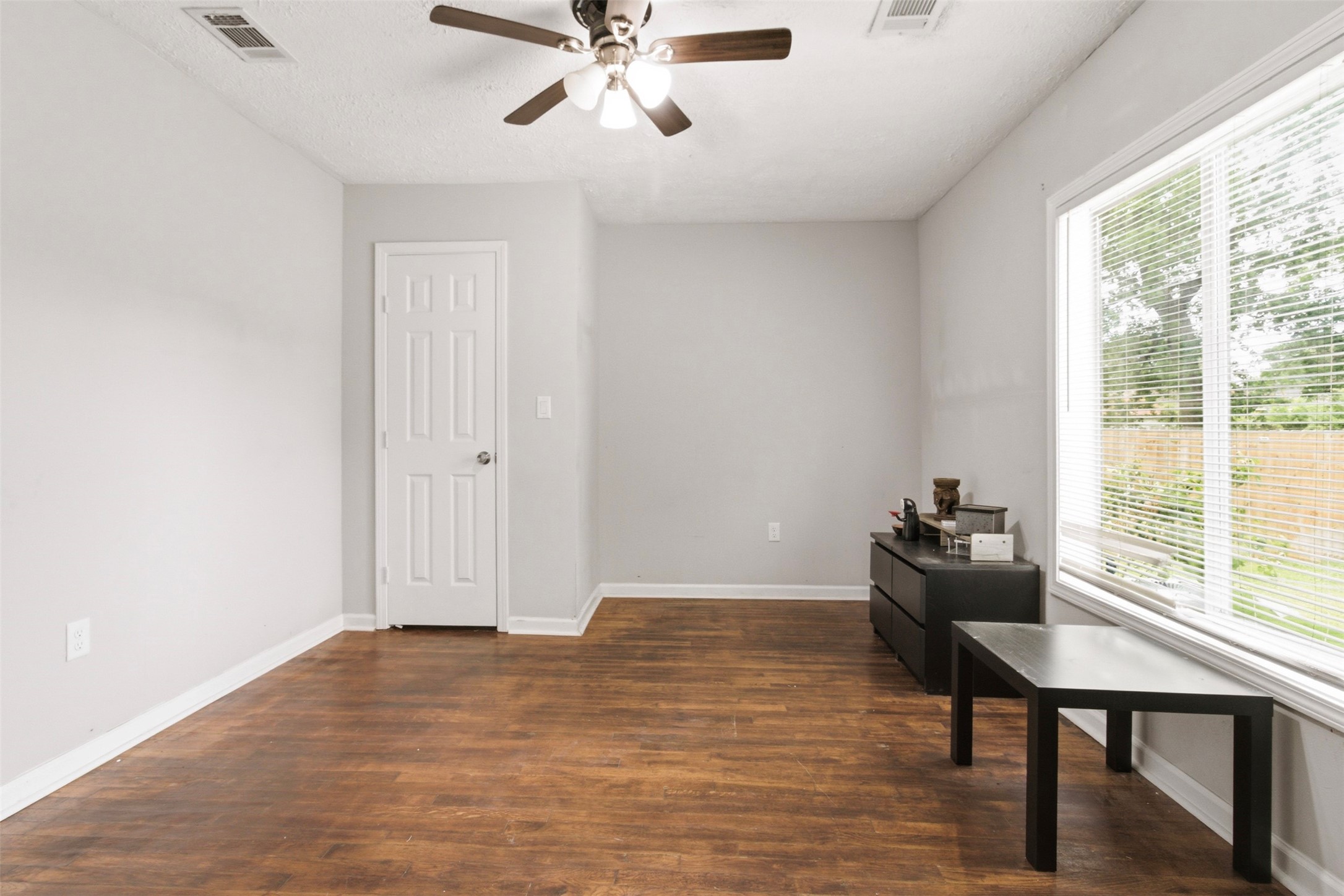 306 Center Street Pasadena, TX 77506 - Photo 19 of 31 a view of a room with wooden floor and windows