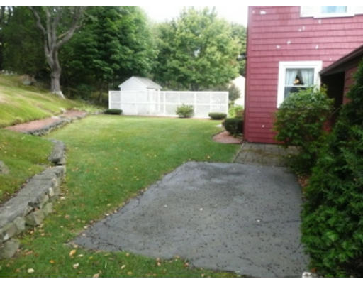 7 Surrey Road Salem, MA 01970 - Photo 14 of 15 a front view of a house with garden