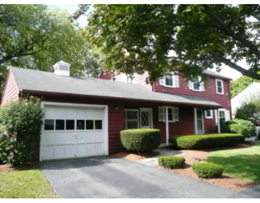 7 Surrey Road Salem, MA 01970 - Photo 6 of 15 a view of a white house with a sink and a yard with plants