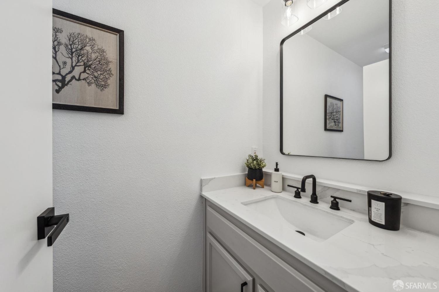 4459 View Place Oakland, CA 94611 - Photo 20 of 40 a bathroom with a sink and a mirror