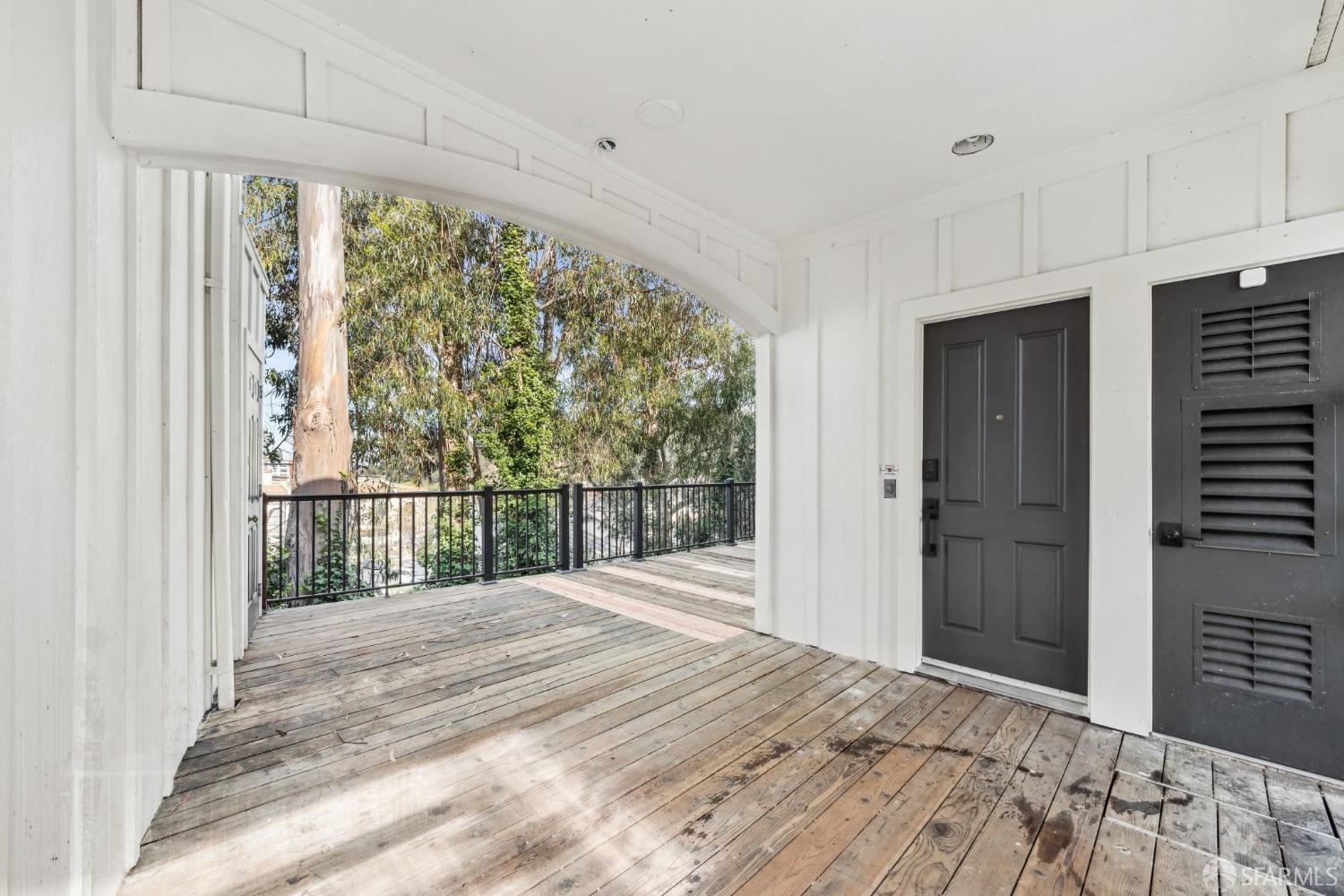 4459 View Place Oakland, CA 94611 - Photo 4 of 40 a view of a bedroom with wooden floor and windows