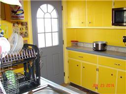 6517 Roy Pearson Road Springfield, TN 37172 - Photo 8 of 15 Another view of the kitchen and the back door.
