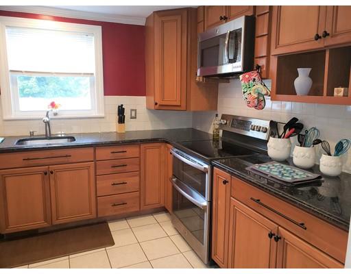 20 Mellen Street Hopedale, MA 01747 - Photo 13 of 22 a kitchen with stainless steel appliances granite countertop a sink stove and cabinets