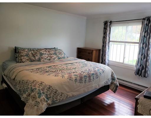 20 Mellen Street Hopedale, MA 01747 - Photo 5 of 22 a bed sitting in a bedroom next to a window