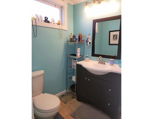 20 Mellen Street Hopedale, MA 01747 - Photo 9 of 22 a bathroom with a sink vanity mirror and toilet