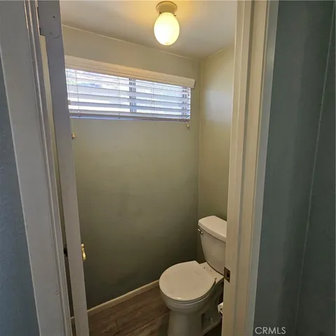 a bathroom with a granite countertop sink and a large mirror