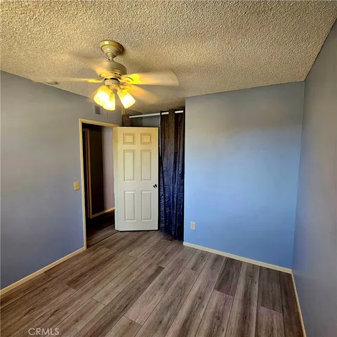 a view of room with window and ceiling fan