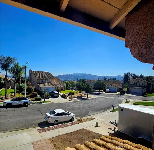 a bathroom with a granite countertop shower and a toilet