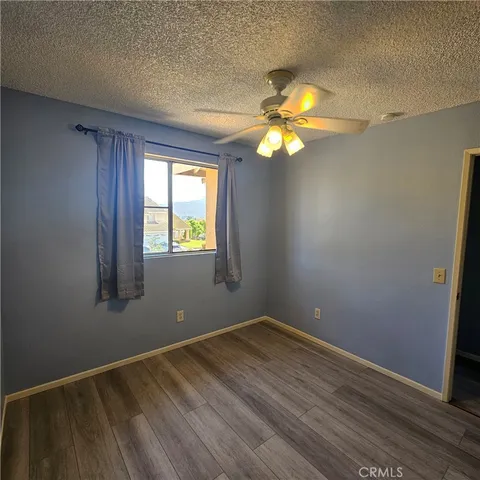 a view of hallway with wooden floor