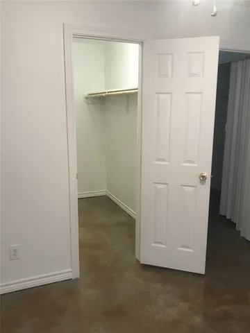 an empty room with wooden floor