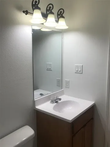a bathroom with a sink and a toilet