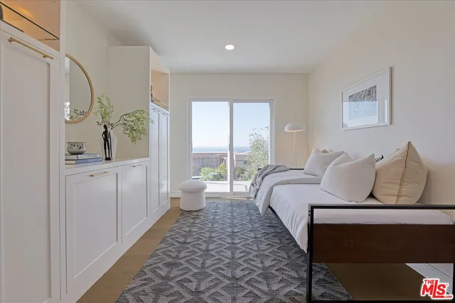 a bathroom with a shower sink and mirror