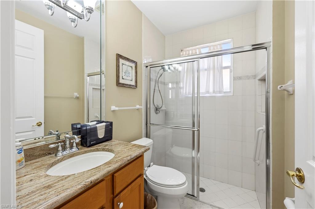 1411 Princess Sabal Point Naples, FL 34119 - Photo 17 of 32 Full bath with a shower stall and vanity